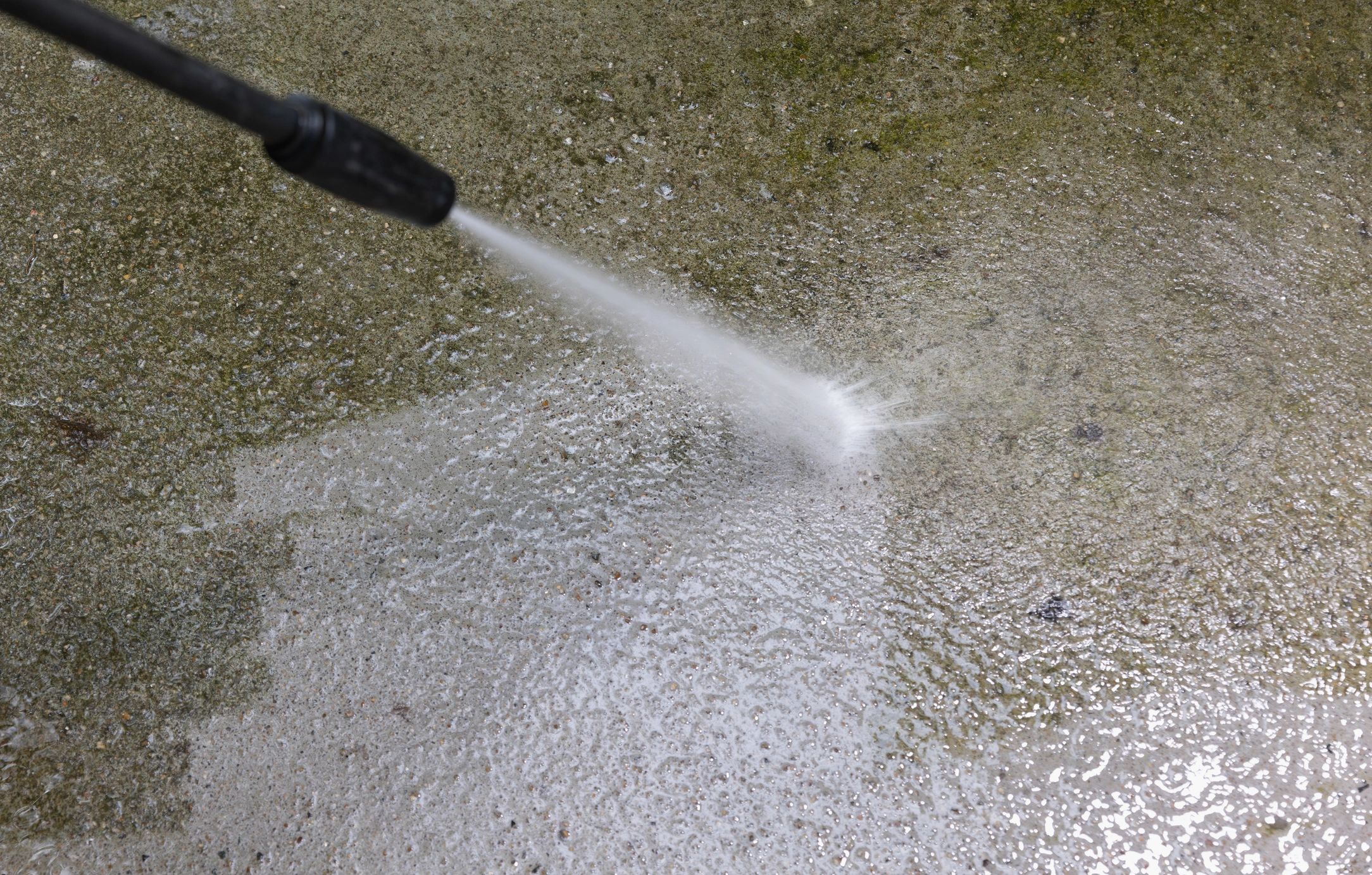 Pressure washing concrete pavement with a surface cleaner